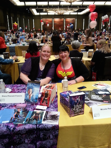 Nicole and me signing